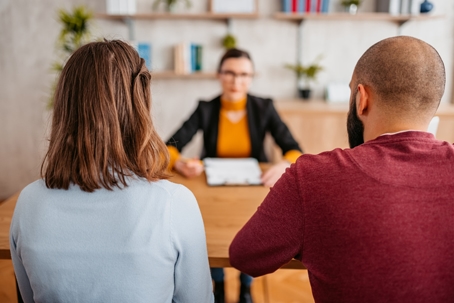 divorcing couple meeting with a lawyer